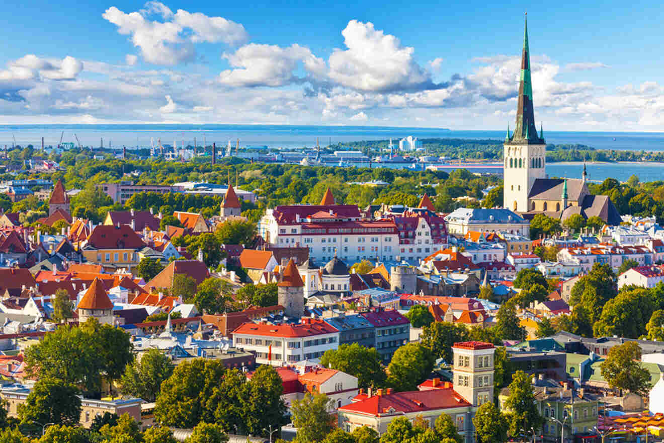 an aerial view of a city with a church steeple