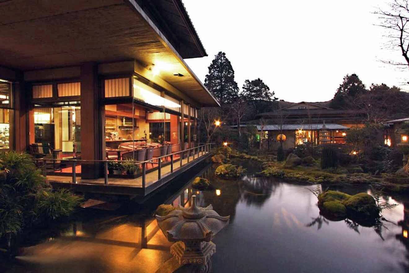 a Hakone Ryokan with a pond next to it