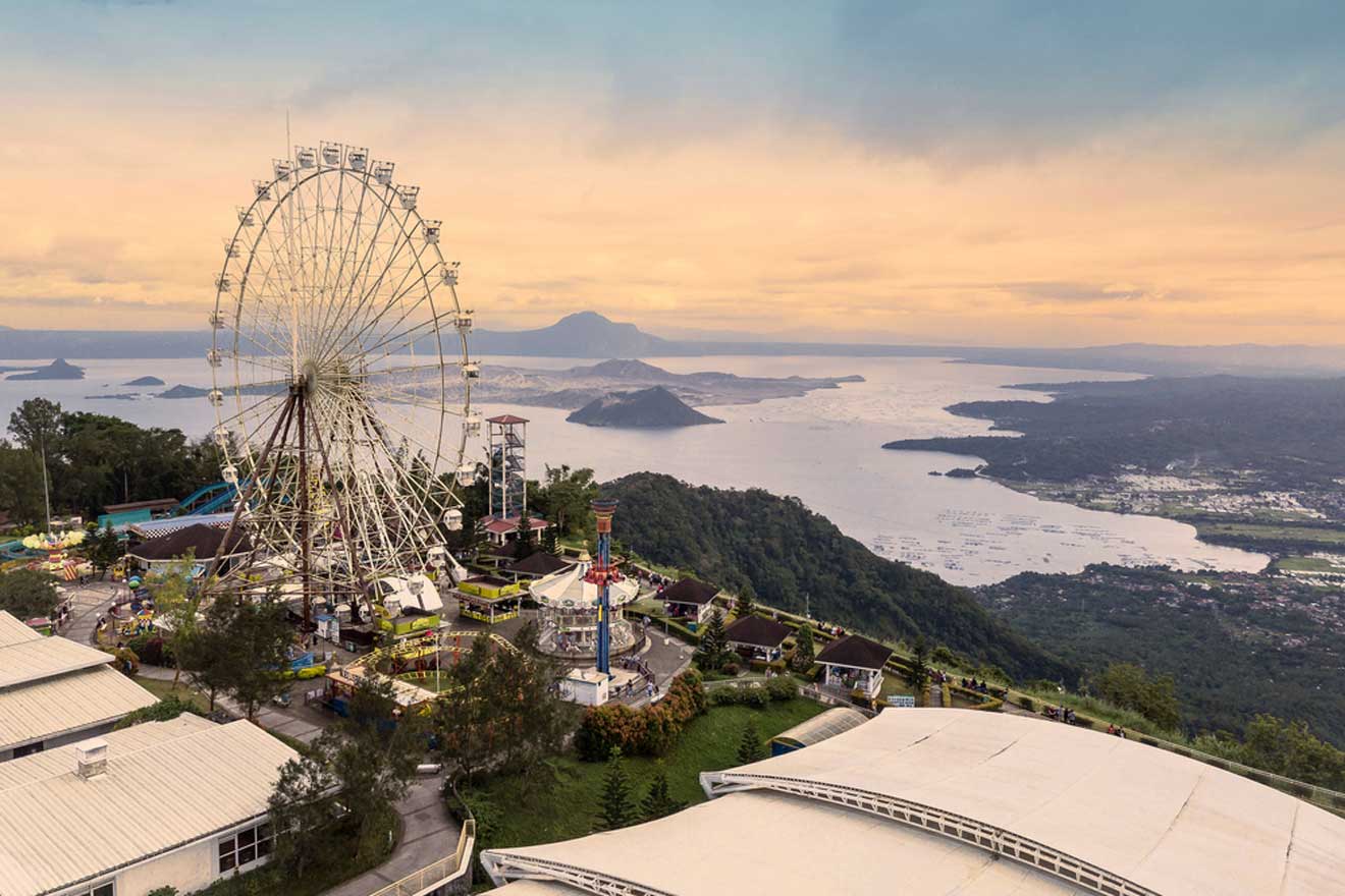 an aerial view of an amusement park with a ferris wheel