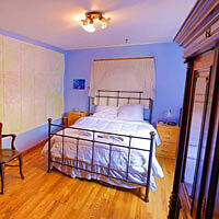 A bed in a room with blue walls.