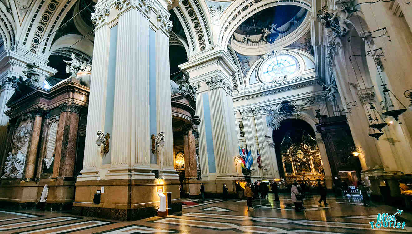 The inside of a cathedral with columns and pillars