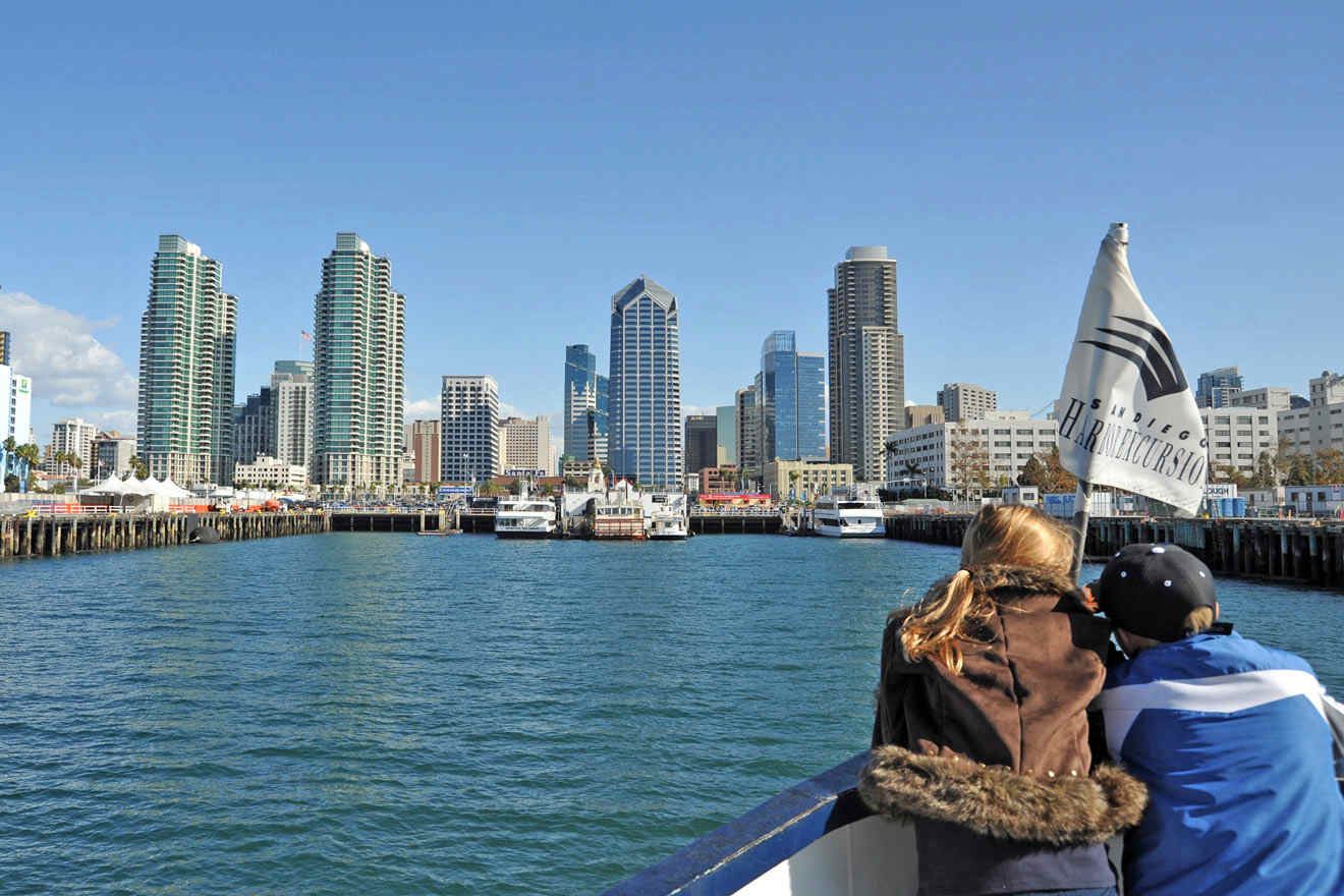 tourists on a boat looking at the city