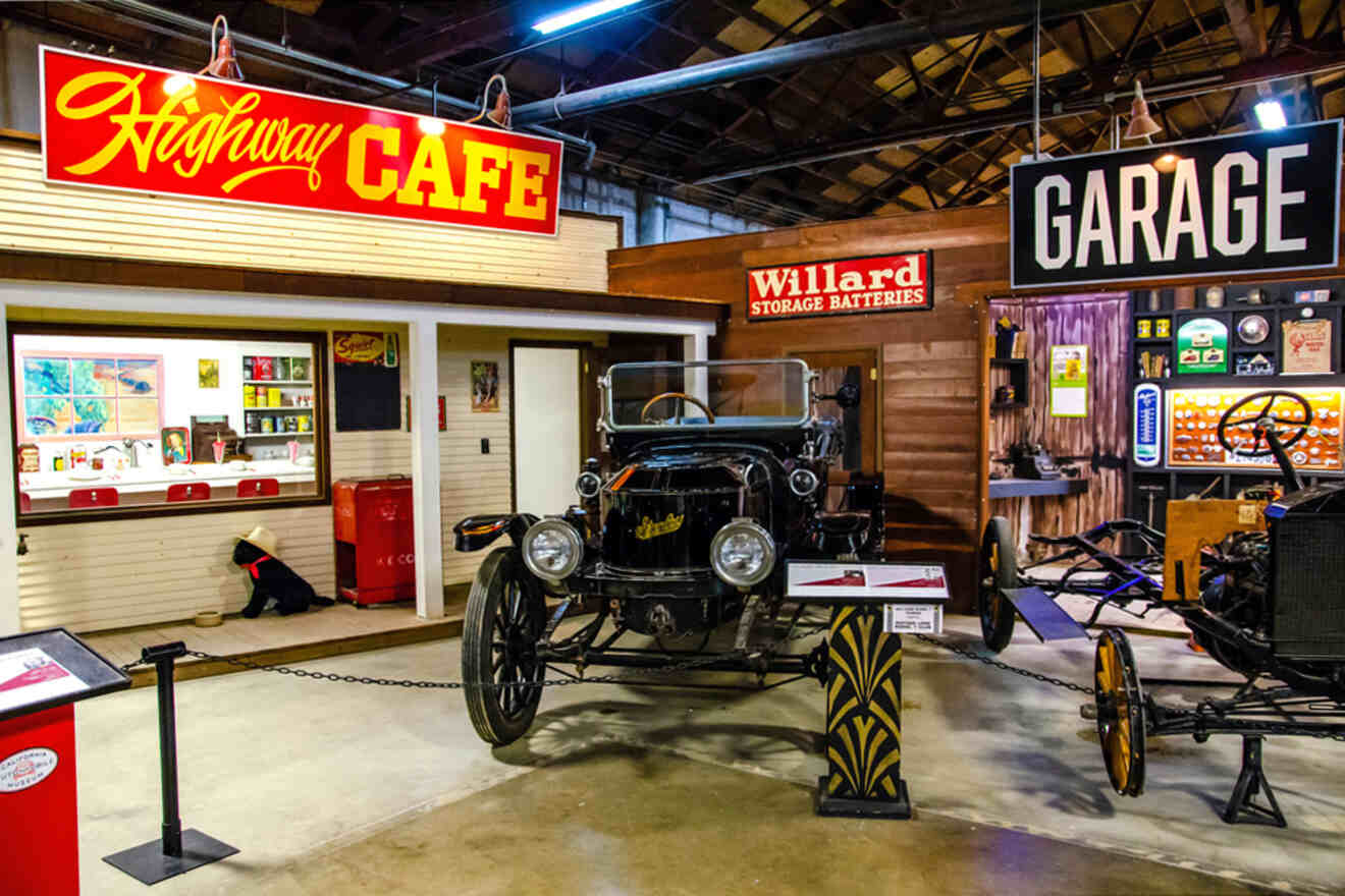 An old car is on display in a museum.