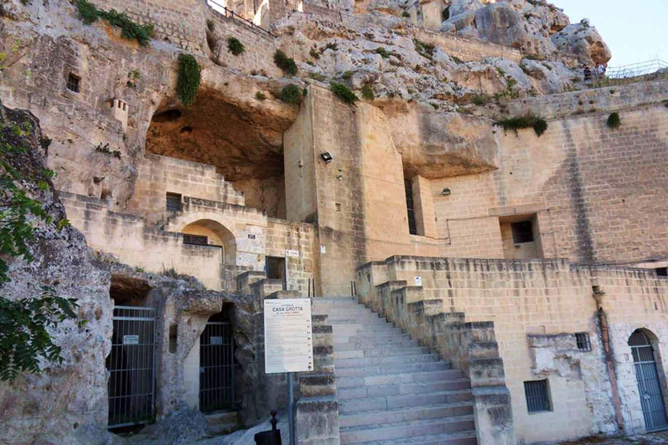 a stone building with stairs leading up to it