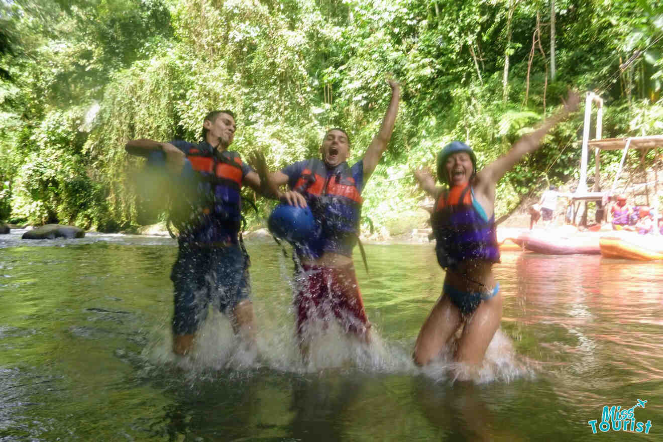 3 people jumping in the water