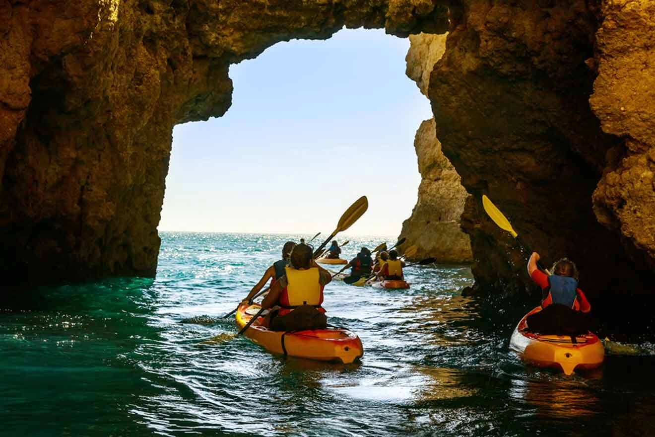 A group of people kayaking through a cave.