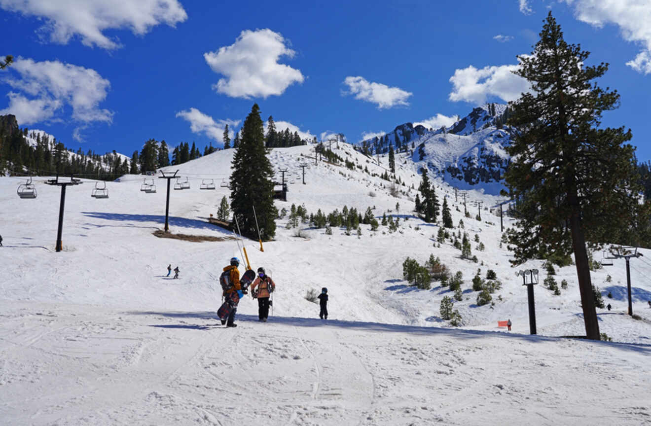 people skiing and snowboarding on hills