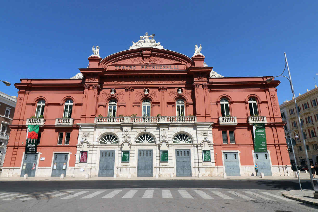 A large red building on the street housing a theatre