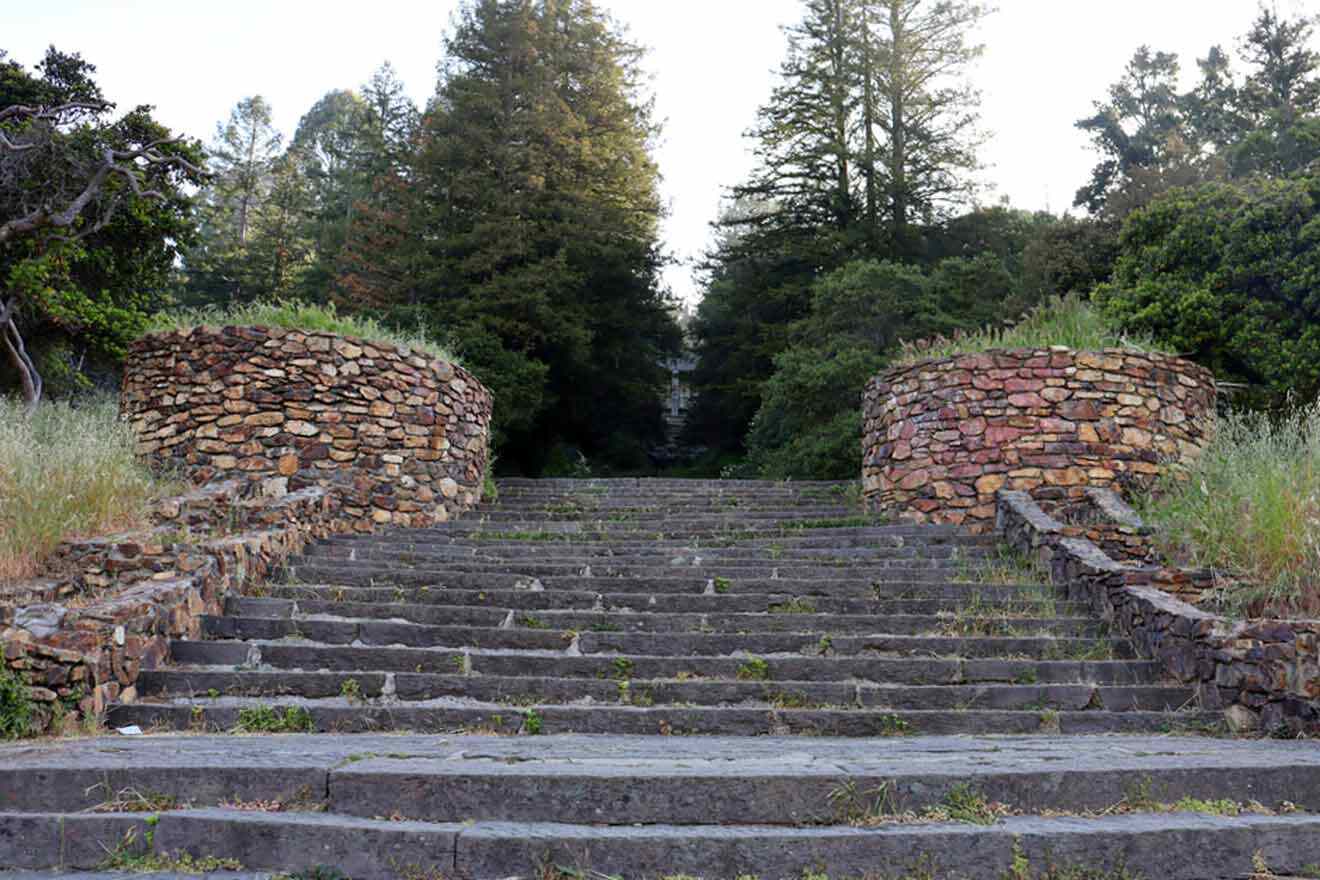 A set of steps leading up to a stone wall.