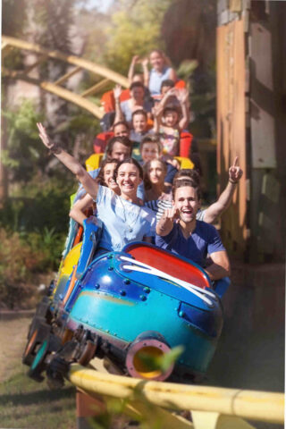 people having fun in a rollercoaster