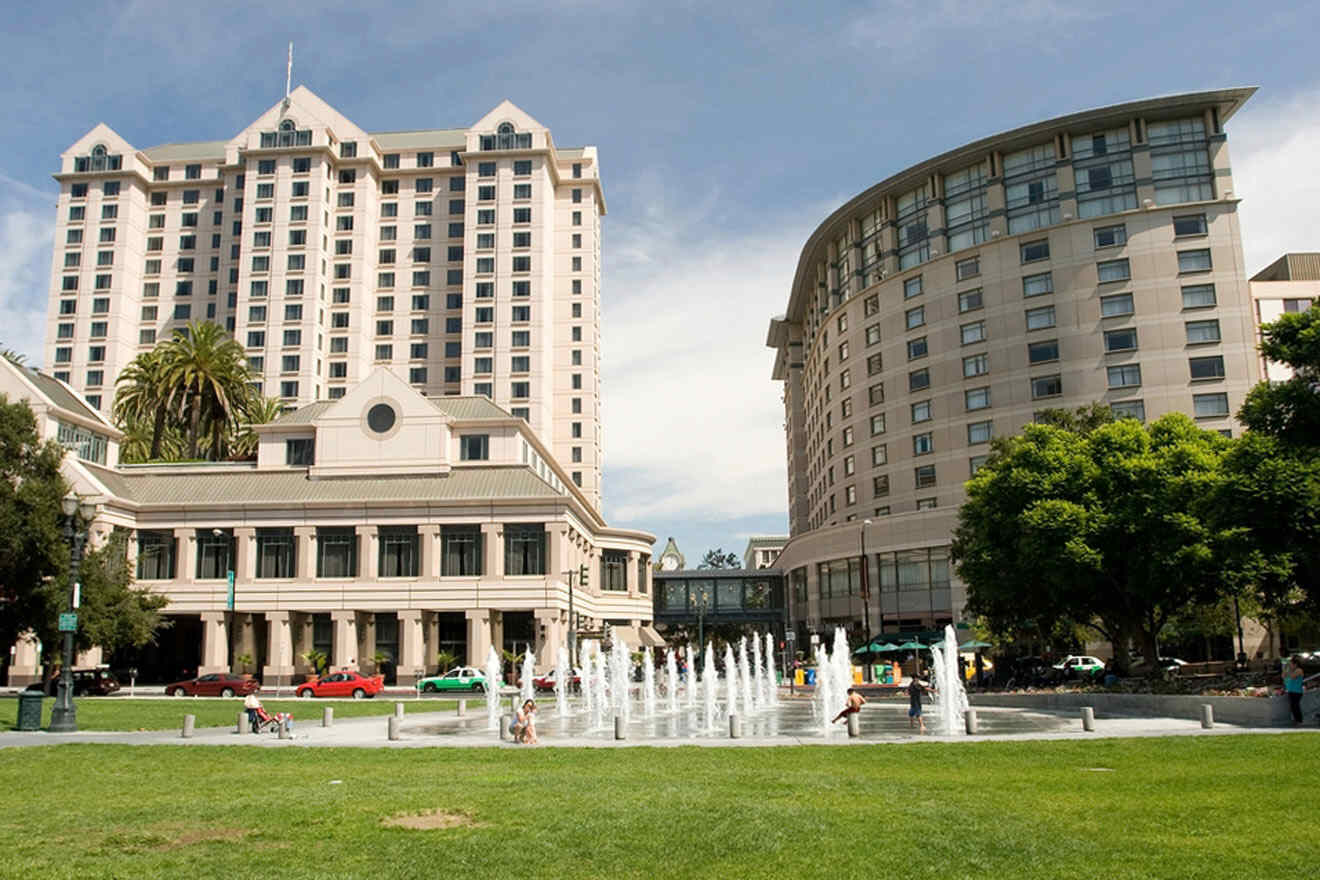 park with fountain with buildings in the background