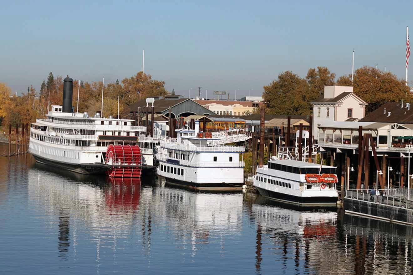 A group of boats docked on a river.