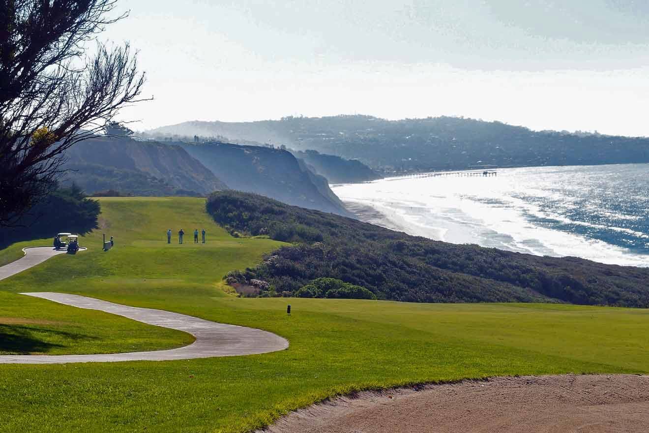 A golf course with a view of the ocean.