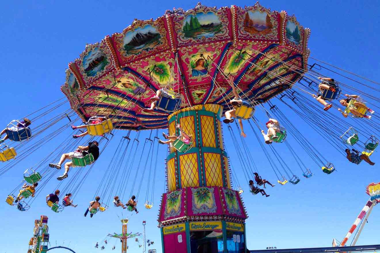 A ride at an amusement park with people on it.