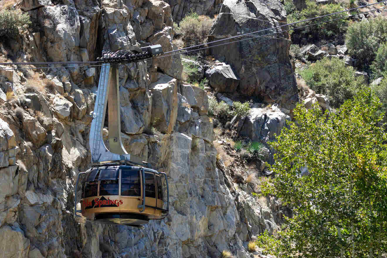 A cable car on a rocky mountainside.
