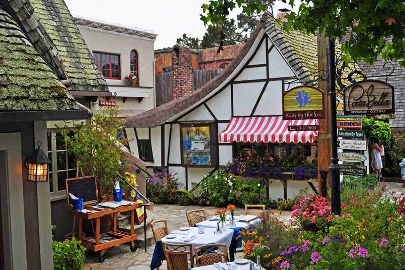 A restaurant with tables and chairs in a courtyard.