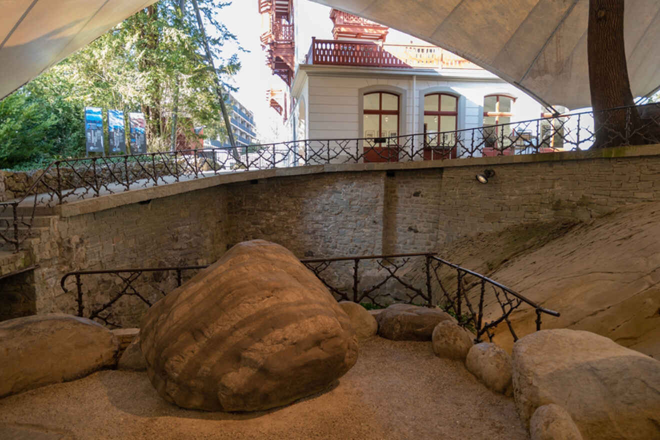 A large rock in the middle of a building.