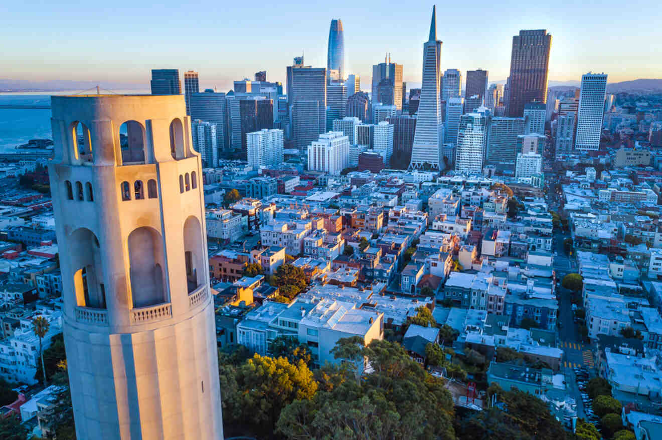 aerial view of a city with a tower in the foreground