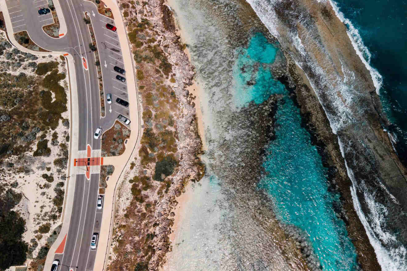 An aerial view of a road near the ocean