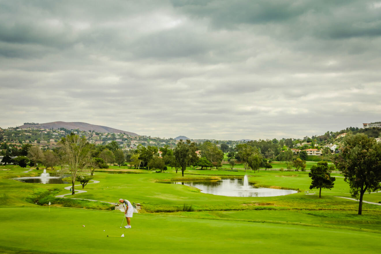 A man in a golf course.