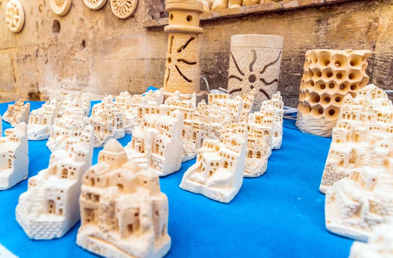 a table topped with lots of white souvenirs