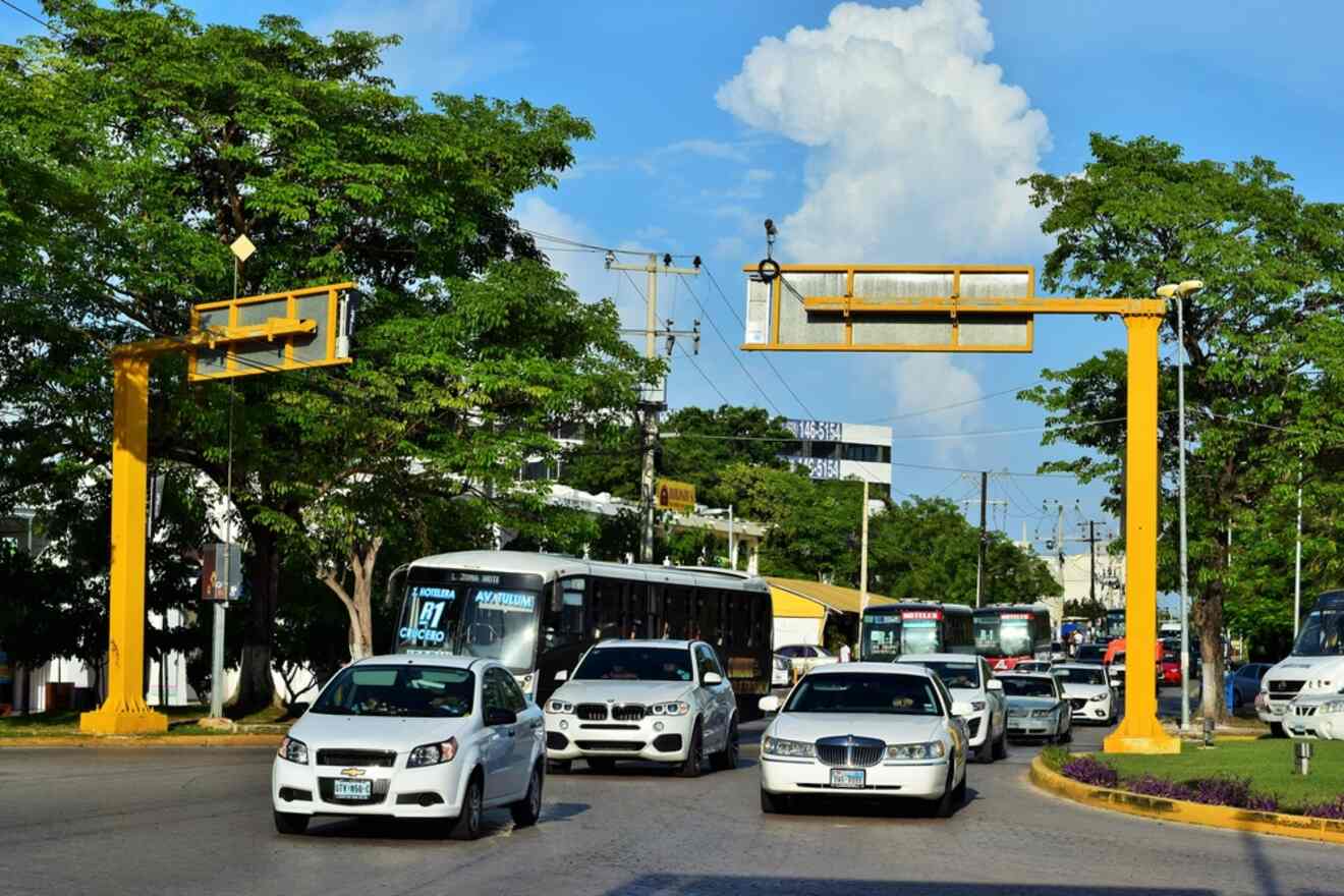 Cars are driving down a street