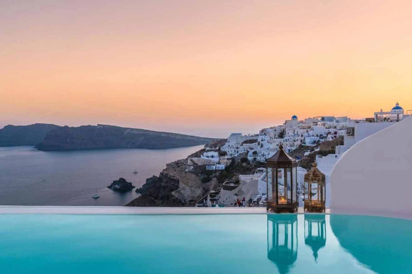 Santorini at sunset with a swimming pool.