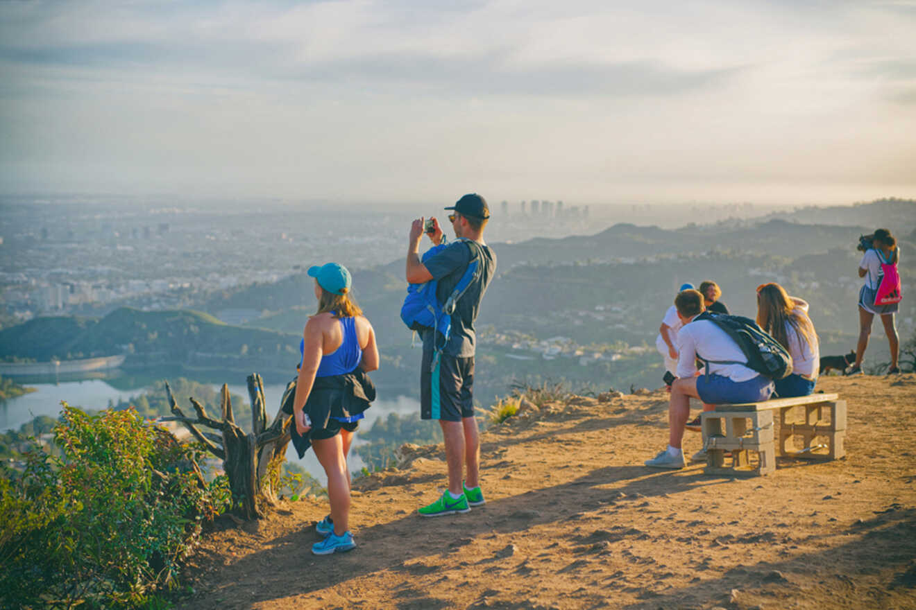 a group of people standing on top of a hill