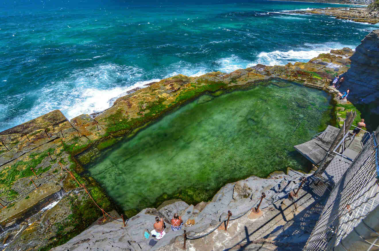 A swimming pool on a cliff overlooking the ocean.