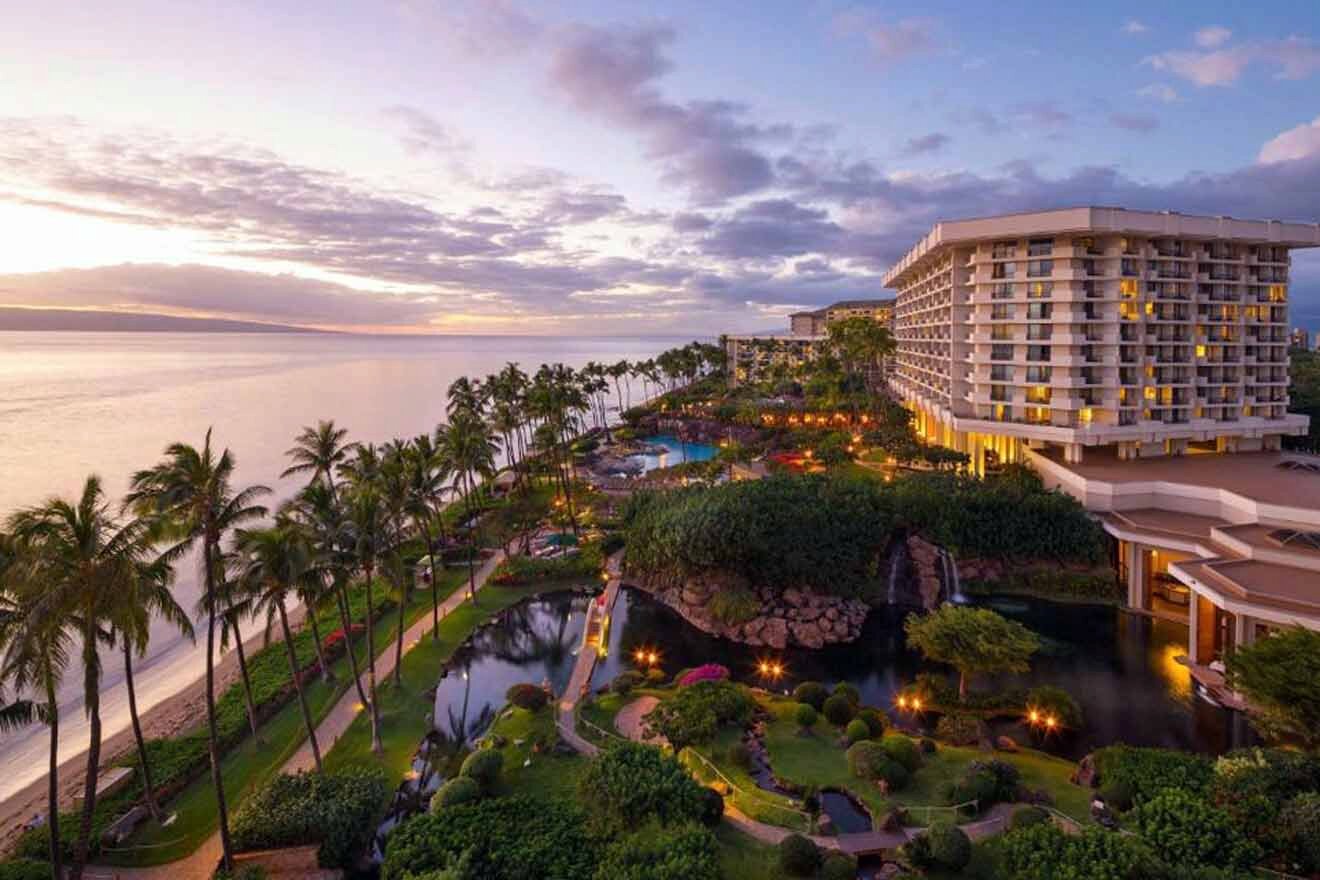 An aerial view of a resort in maui at dusk.