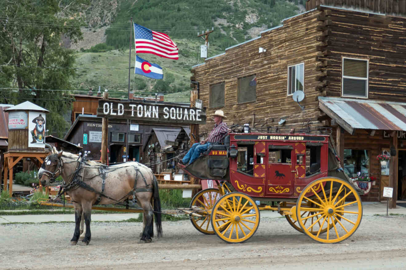 A horse drawn carriage in front of a building.