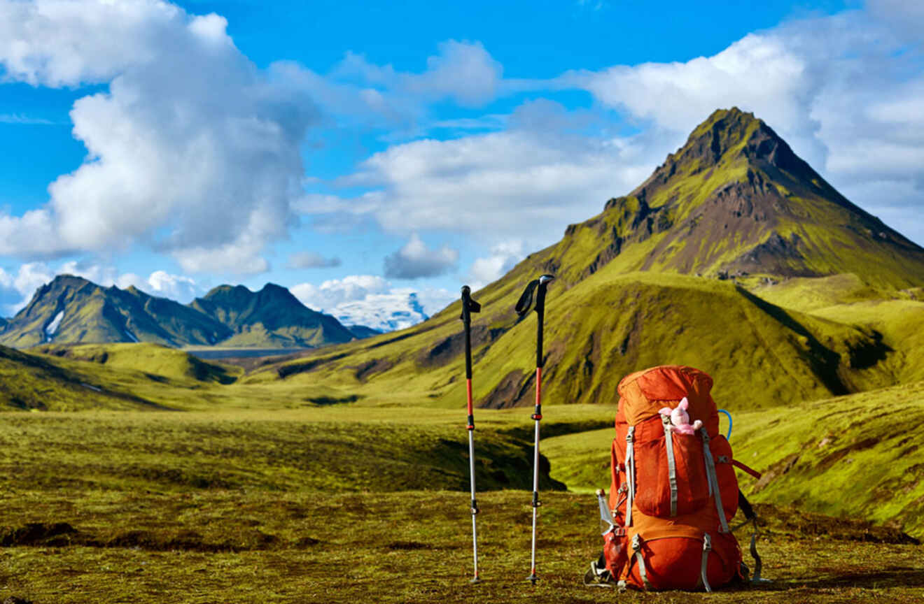 view of hiking gear on the ground with mountains in the background