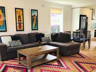 A living room with a couch and a coffee table.