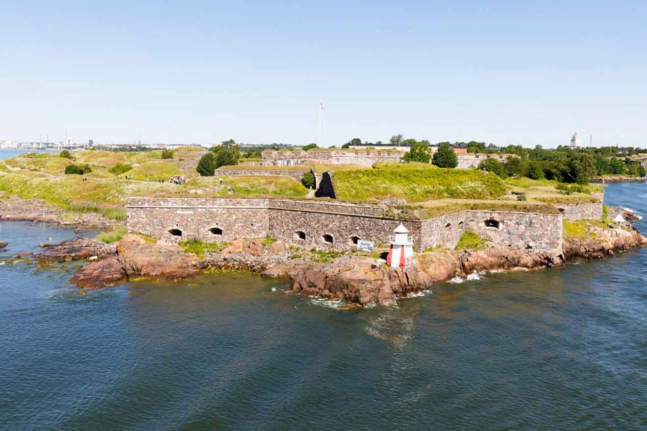 A fort on an island in the middle of a body of water.