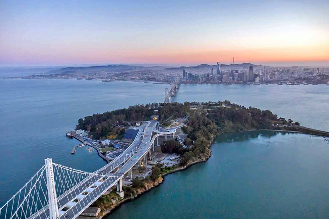aerial view over the treasure island and bridges in San francisco bay bridge at sunset.