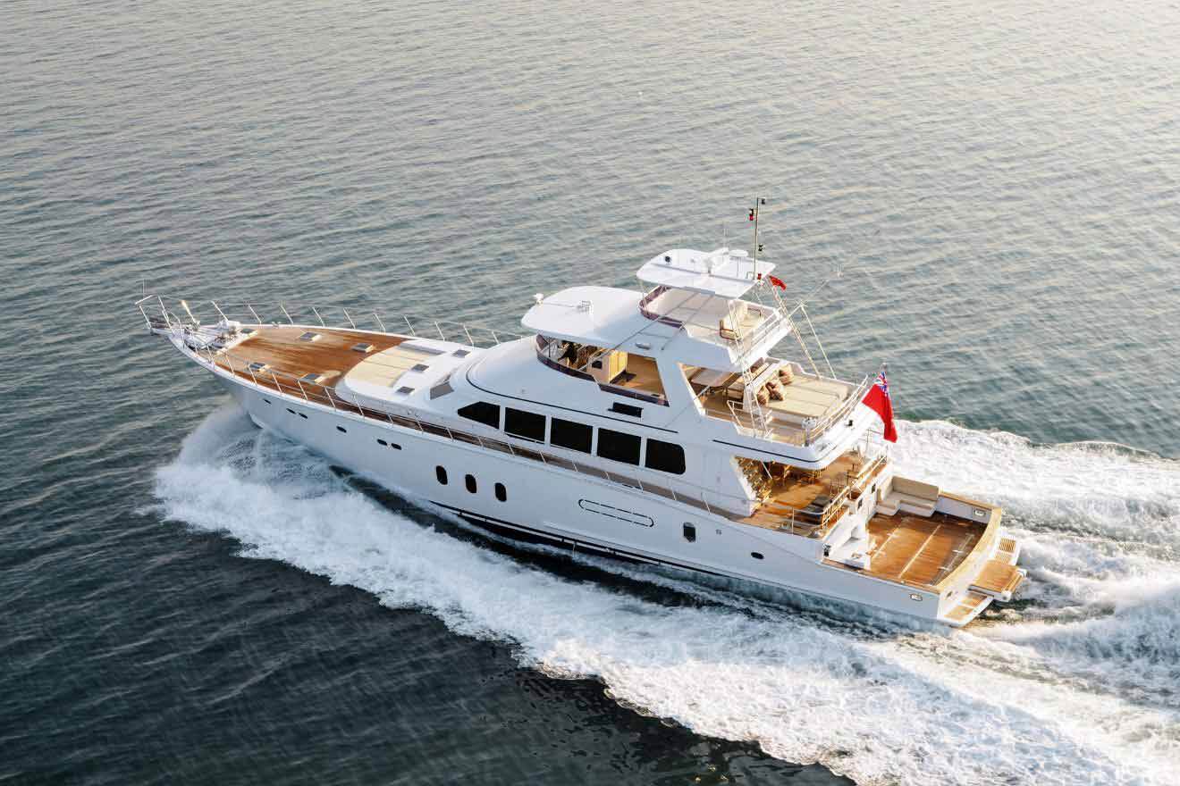 A white motor yacht traveling in the ocean.