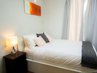 A bed or beds in a room at sydney apartment rentals.