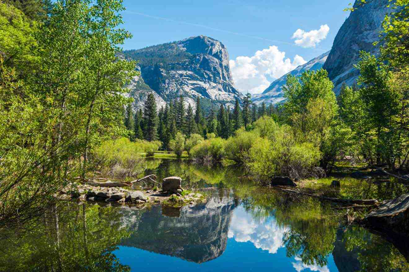 lake with mountains and rocks in the background at Yosemite national park in california.