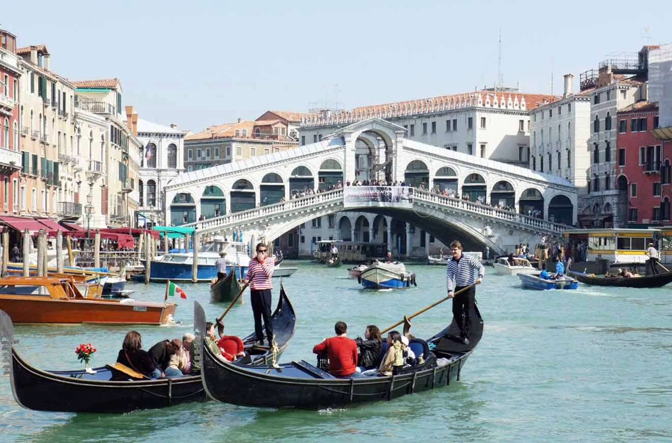 A group of gondolas on a canal in venice.