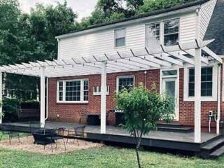 A house with a patio and a pergola.