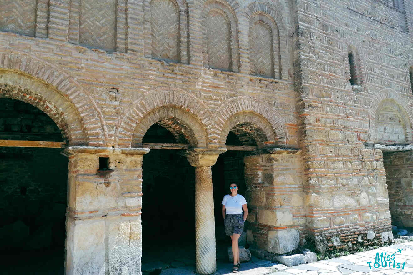 a girl posing in front of a church