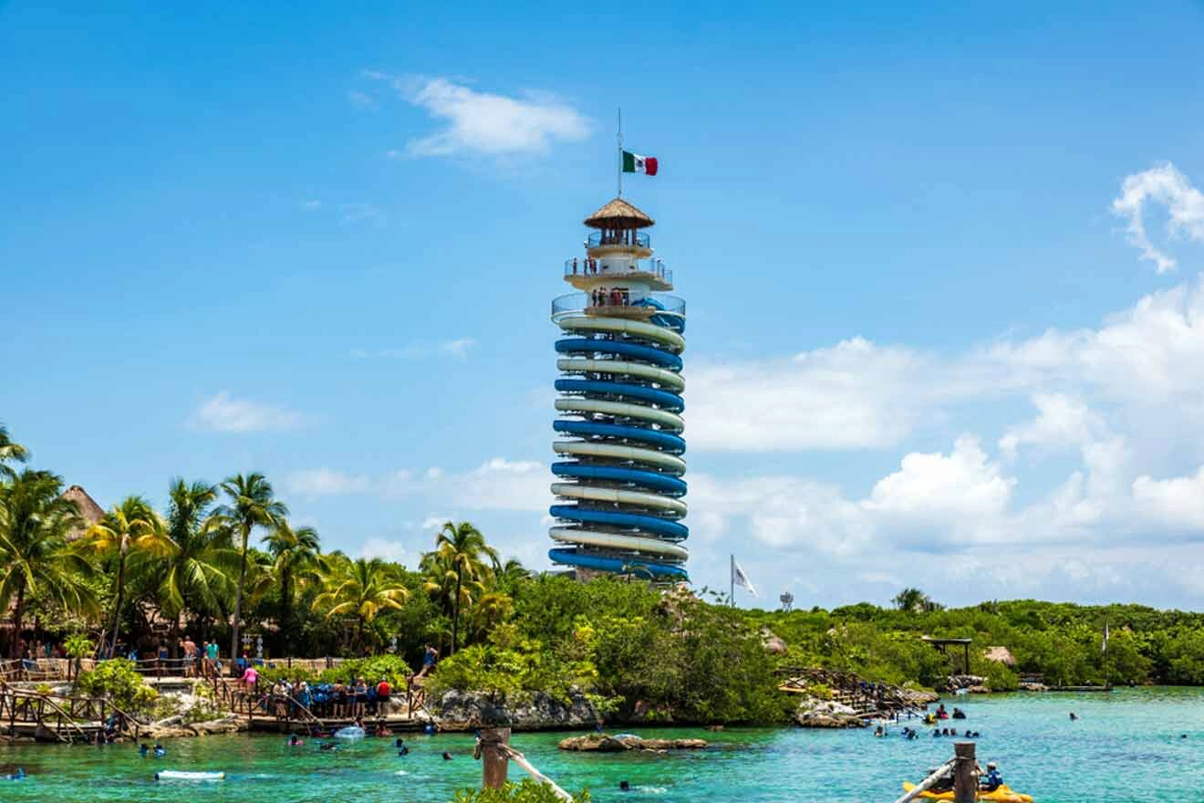 A group of people on a boat near a tower in the water.