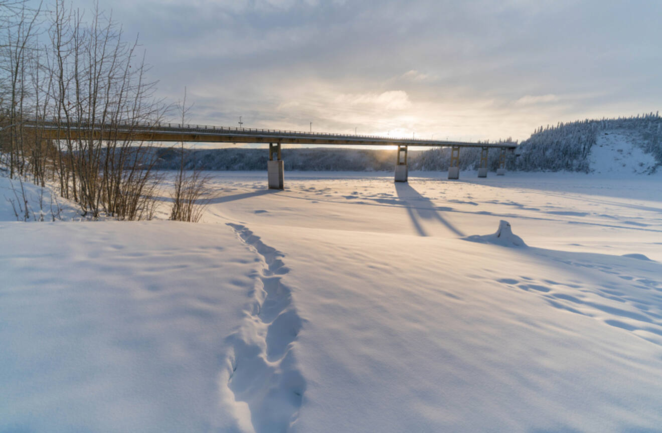 view of a bridge over a frozen river