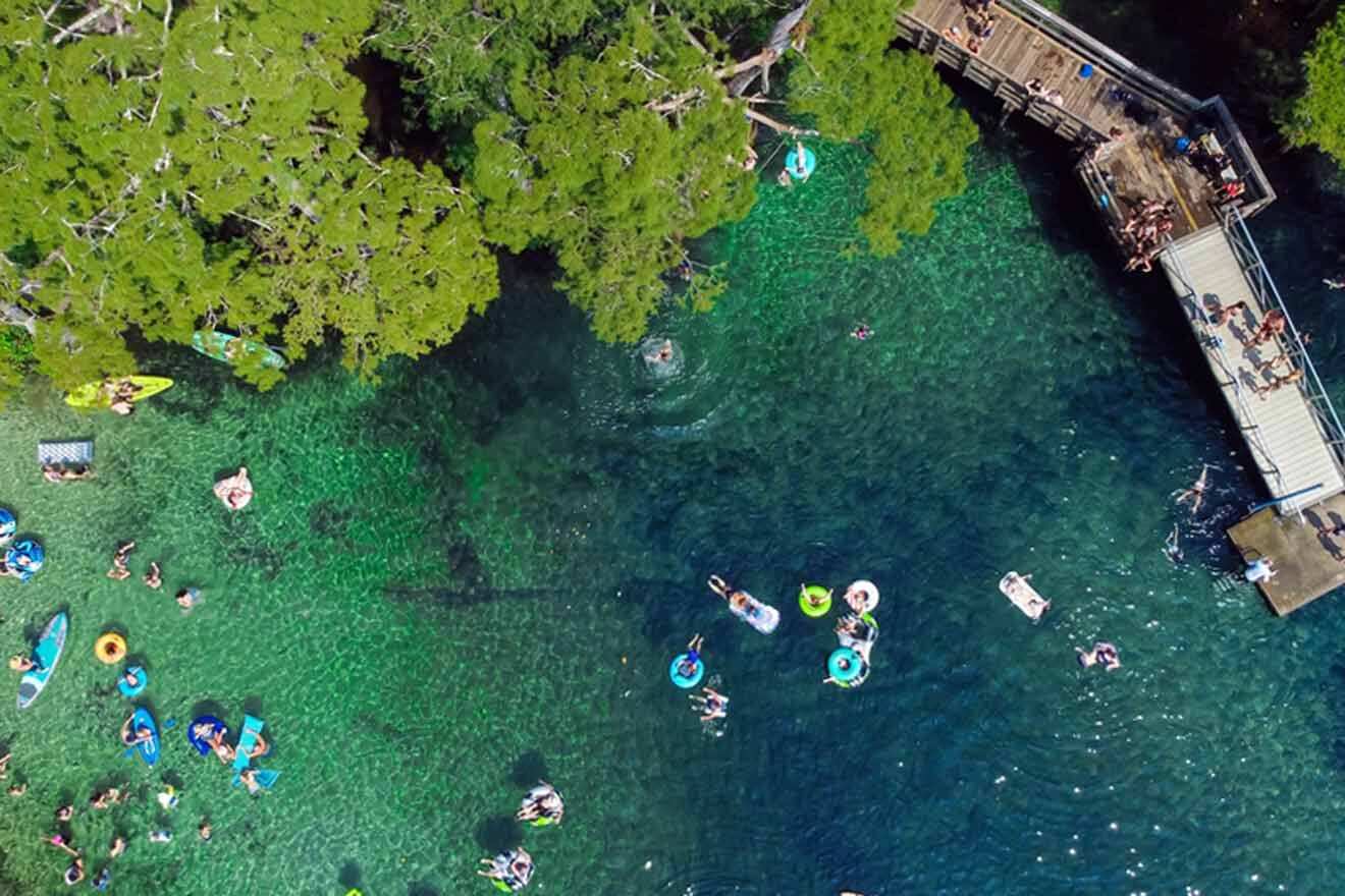 An aerial view of a group of people in the water.