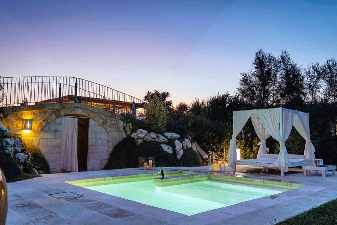 A swimming pool in a garden at dusk.