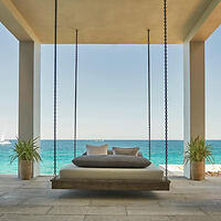 a bed swing on a hotel terrace