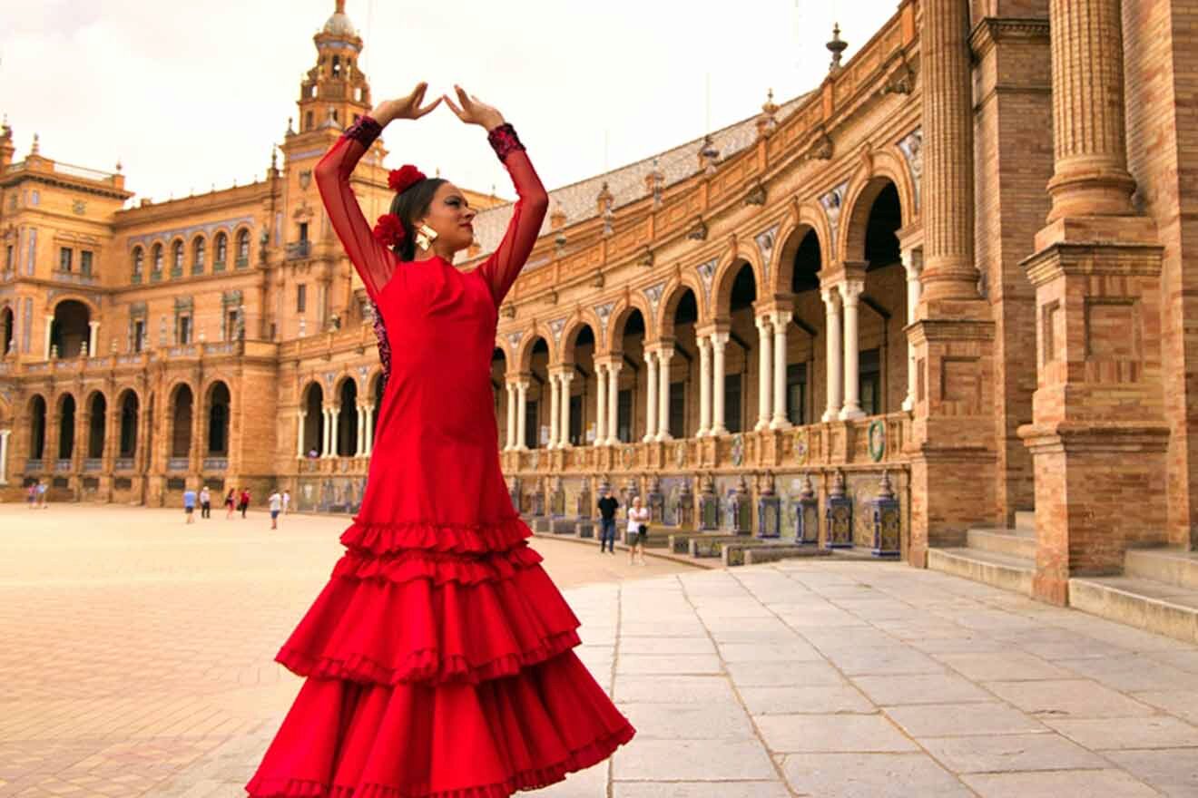 A woman in a red dress is dancing in front of an ornate building.