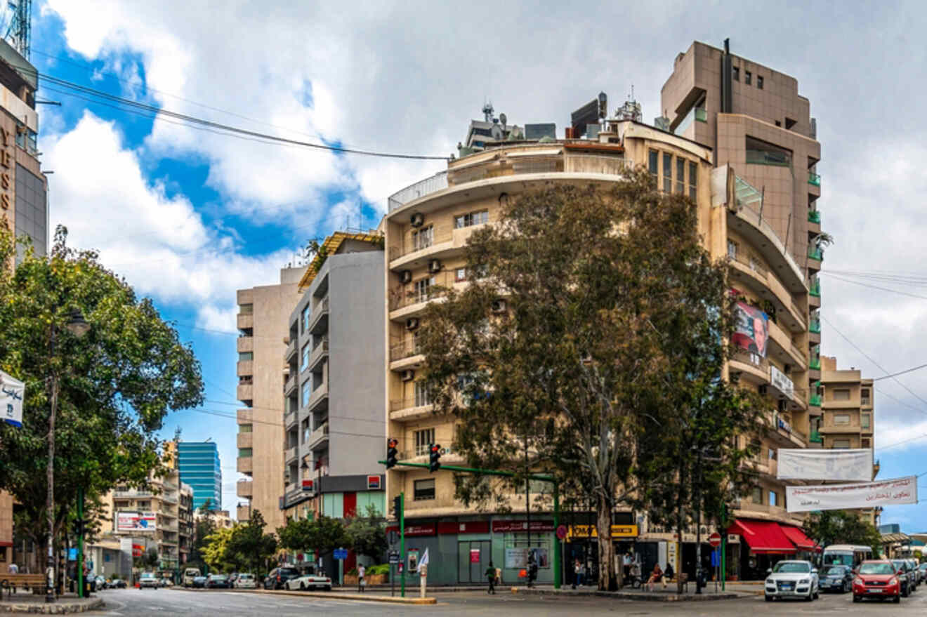 A view of a city with tall buildings and cars.