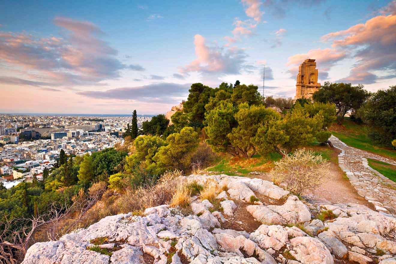 A view of the city of athens from the top of a hill.
