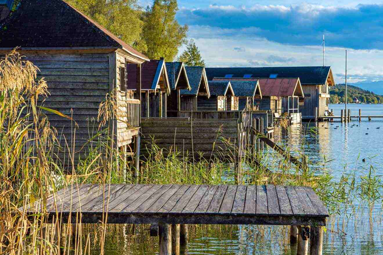 Wooden cabins on the shore of a lake.